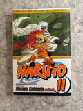 Naruto Shonen Jump Manga Volume 11 manga book cover, featuring Naruto and Itachi Uchiha.