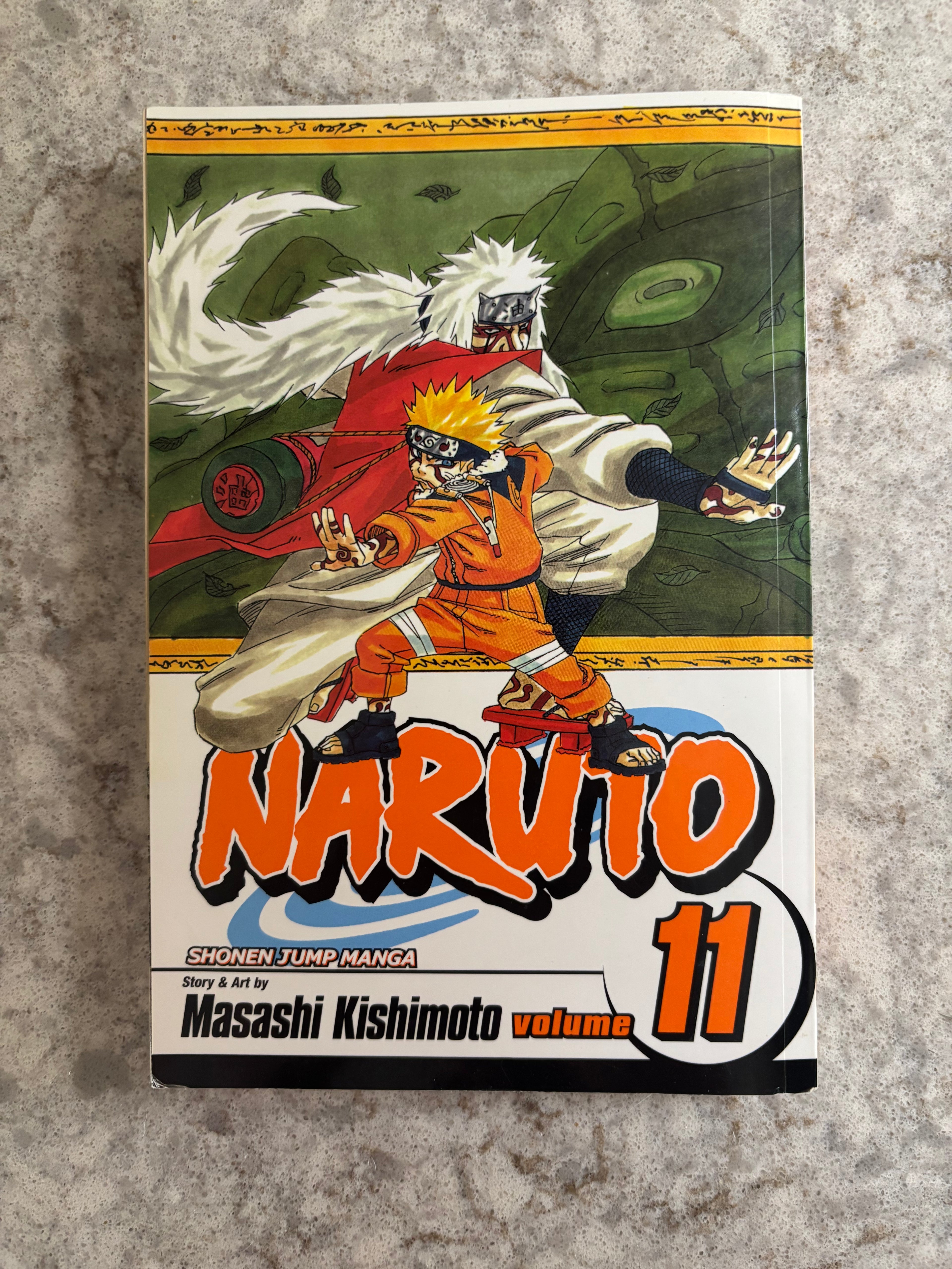 Naruto Shonen Jump Manga Volume 11 manga book cover, featuring Naruto and Itachi Uchiha.